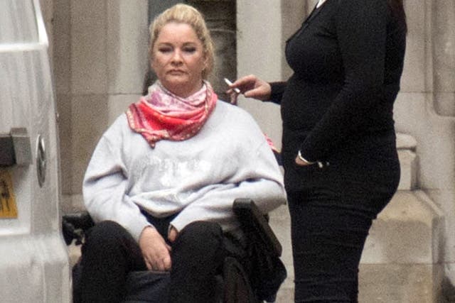 Claire Busby, (left) outside the High Court in London, where she is suing Beds Are Uzzz, for seven-figure damages