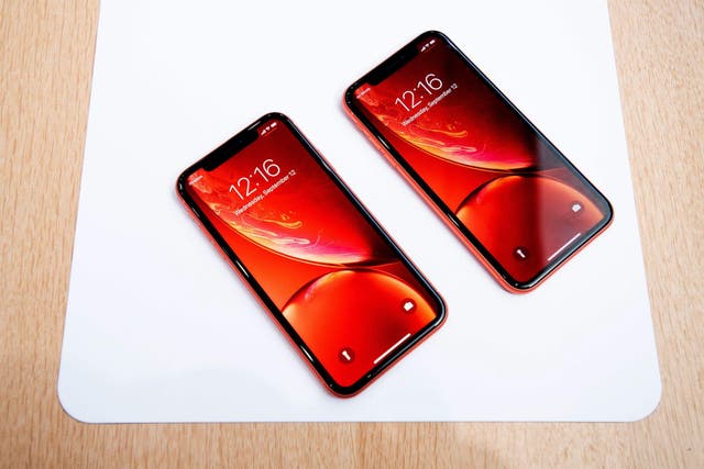 Apple iPhone Xr models rest on a table during a launch event on September 12, 2018, in Cupertino, California