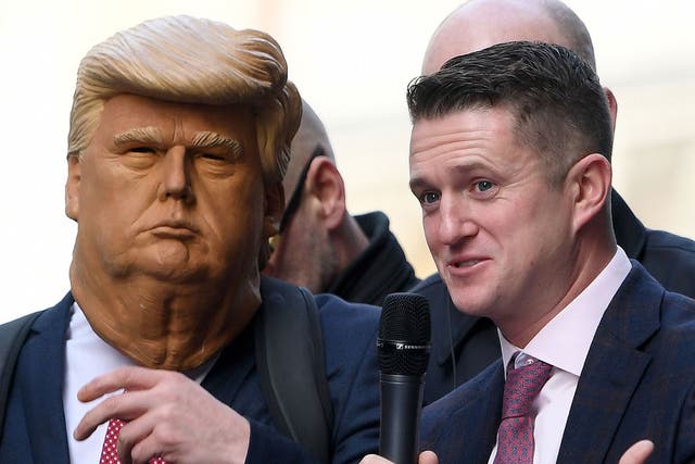 Tommy Robinson with a supporter dressed as Donald Trump addressing a crowd outside the Old Bailey from a stage on 23 October