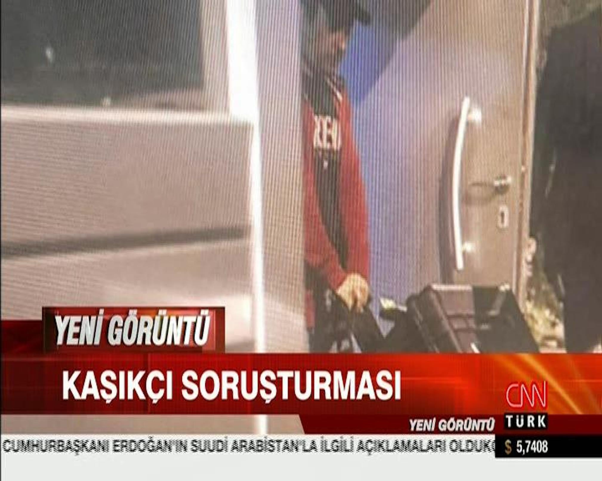 Still from security camera footage broadcast on CNN Turk shows what appears to be Saudi consular officials carrying a large case