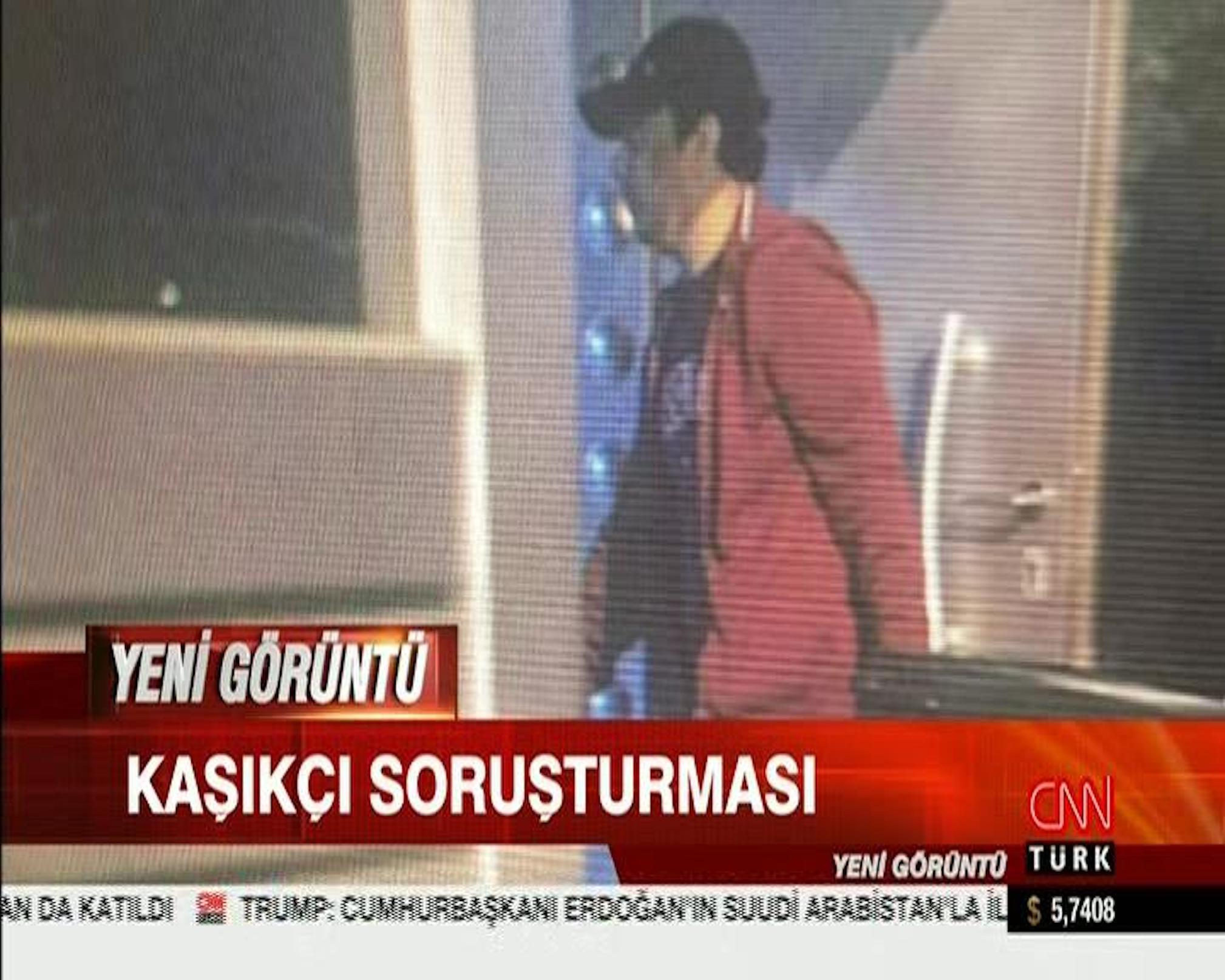 Still from security camera footage broadcast on CNN Turk shows what appears to be Saudi consular officials carrying a large case