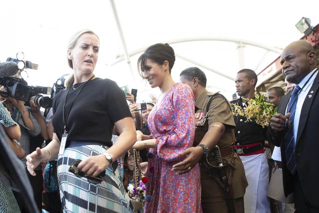 The Duchess of Sussex visiting a market in Fiji during the royal tour
