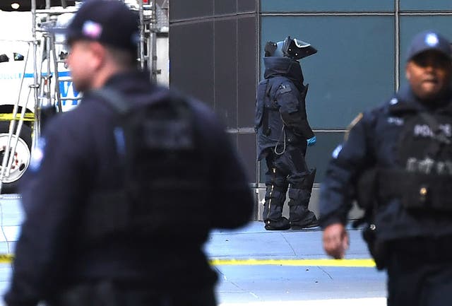 New York City Police Department Bomb Unit personnel arrive outside the Time Warner Building on 24 October 2018 after an explosive device was delivered to CNN's New York bureau. (TIMOTHY A. CLARY/
