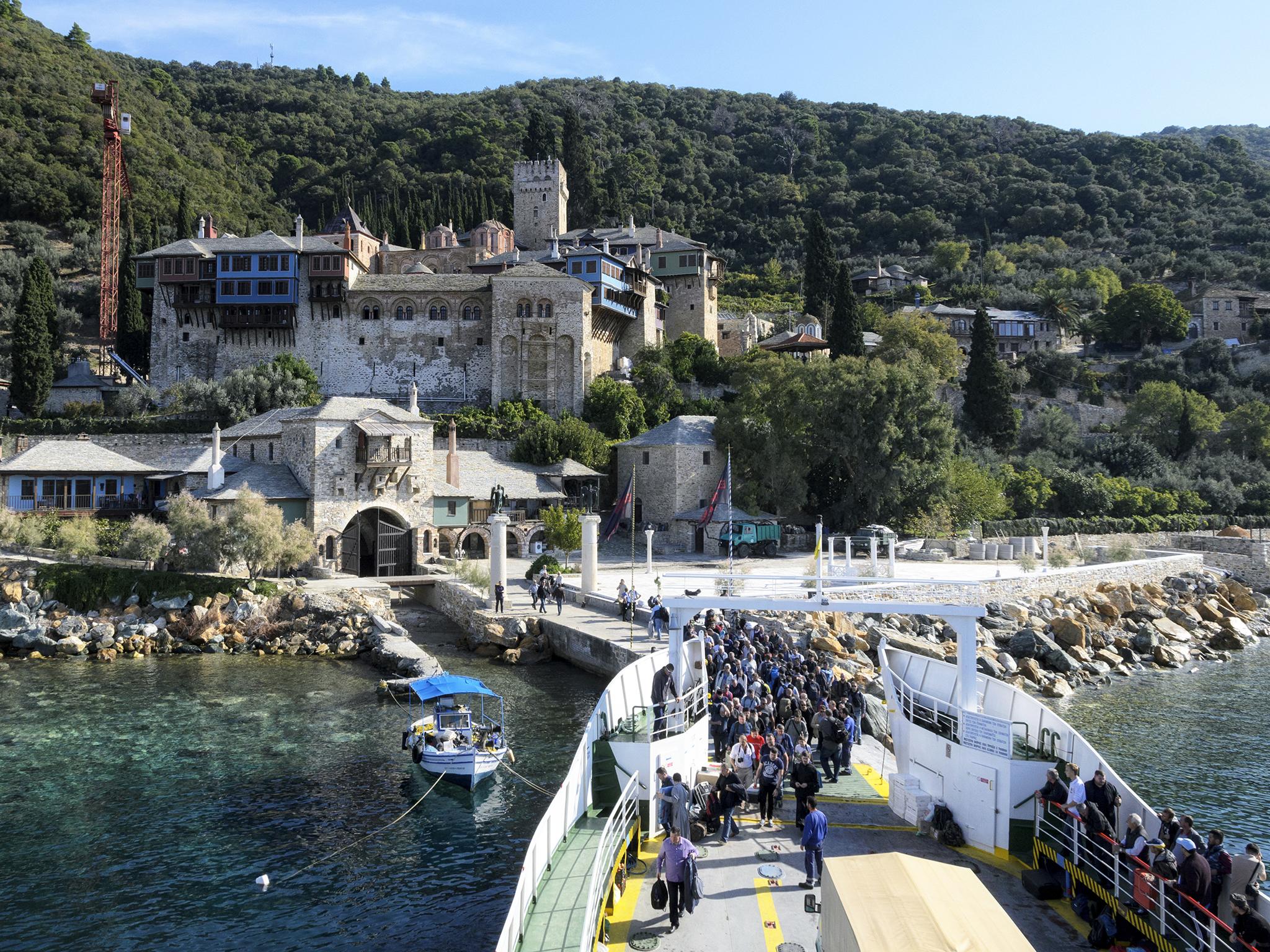A stead stream of pilgrims, such as these at the Dohyar monastery, arrive at Mount Athos