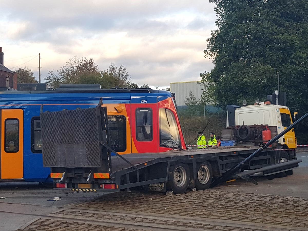 Tram derails on first day of new £75m service after colliding with lorry