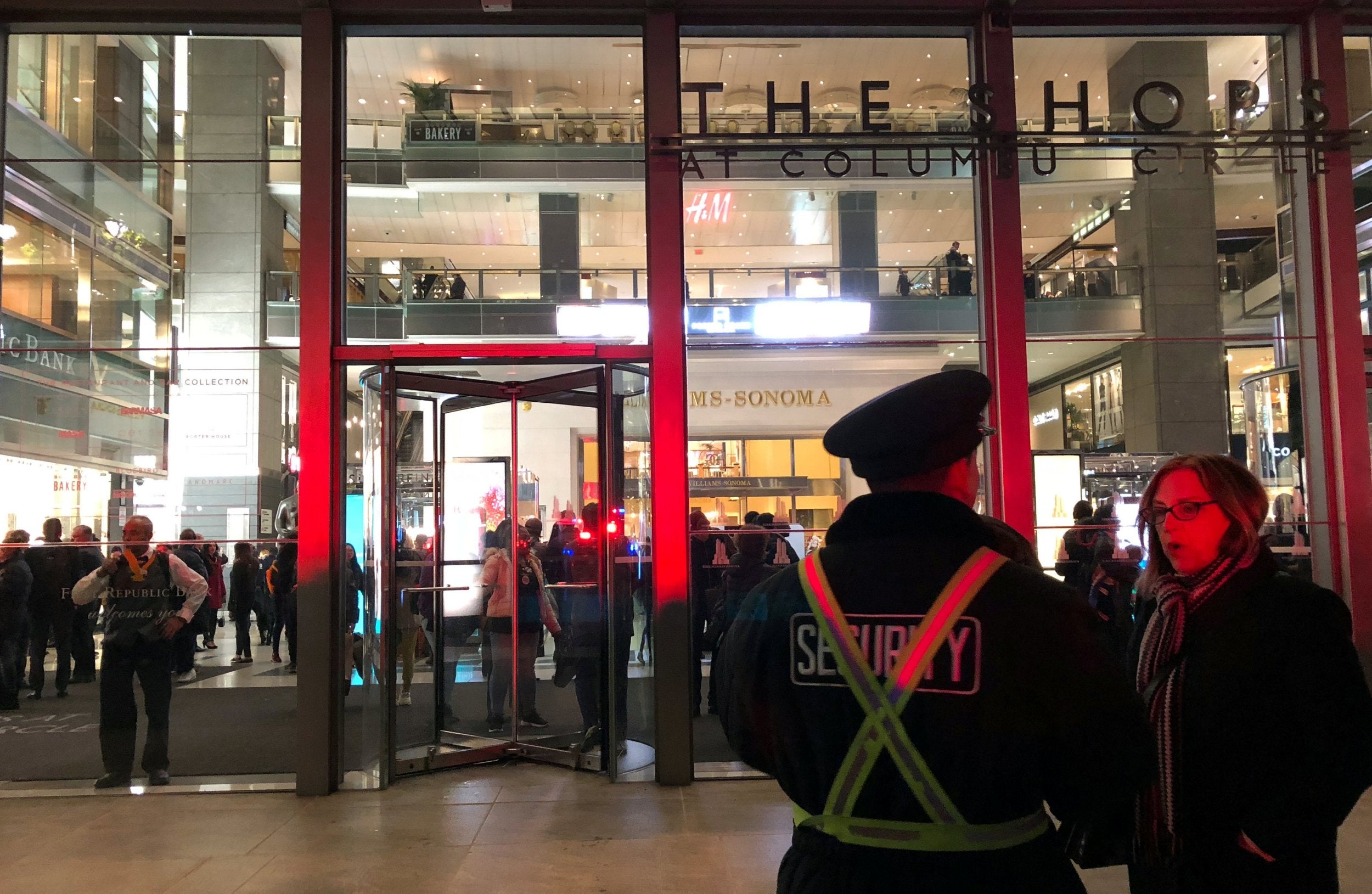 Crowds begin to evacuate from the Time Warner Center in New York amid reports of two suspicious packages