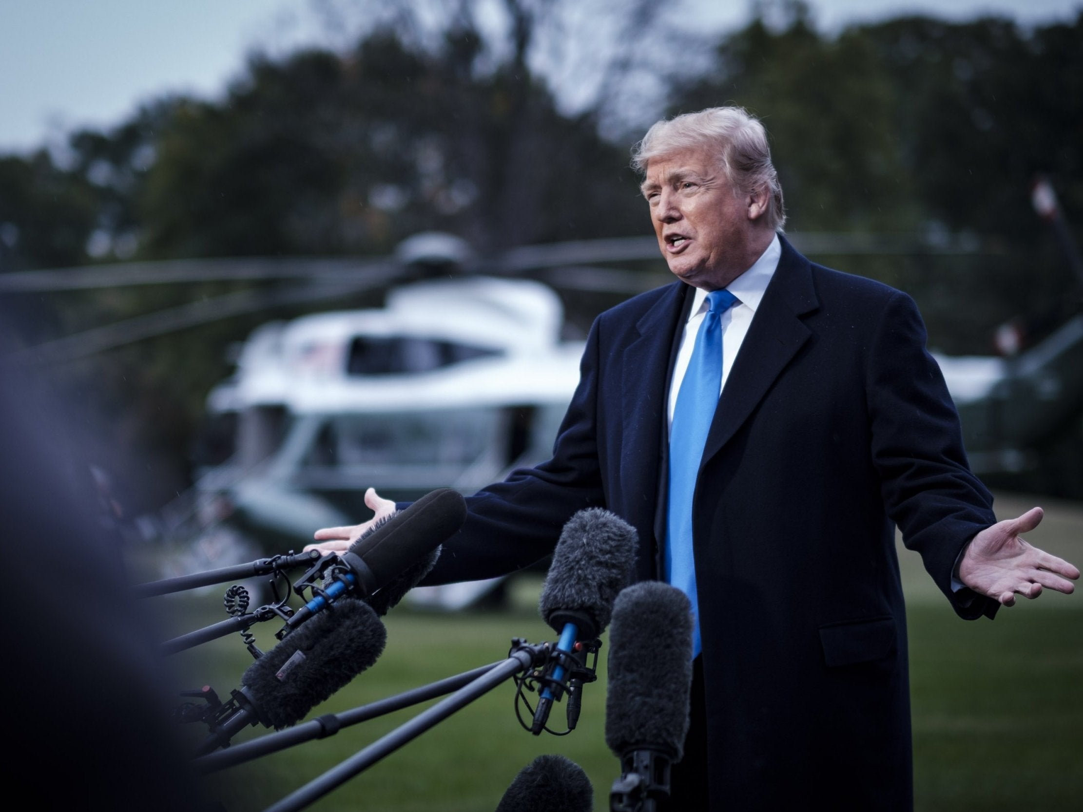 President Donald Trump speaks to the media as he prepares to board Marine One on the south Llawn of the White House