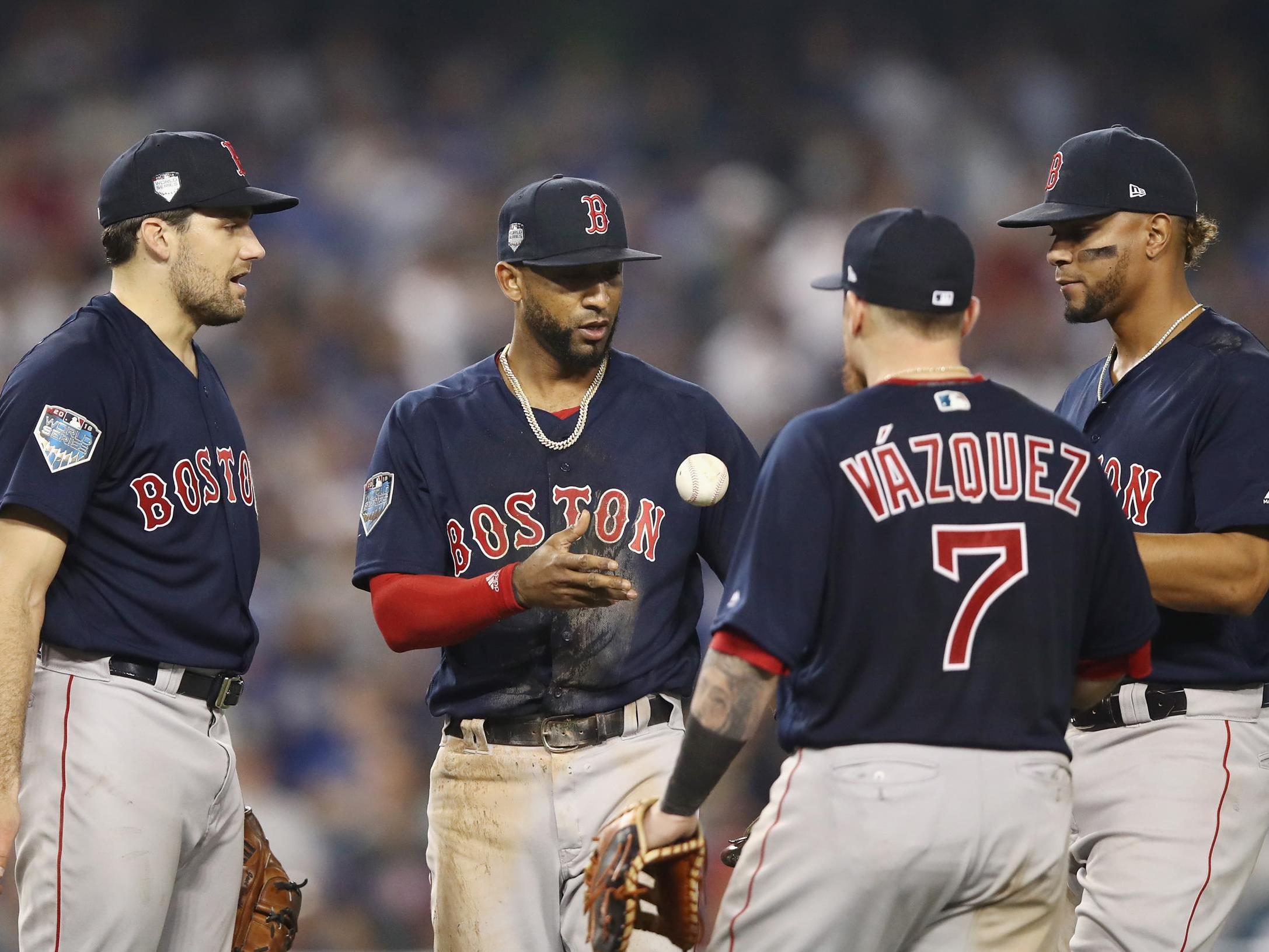 Eduardo Nunez is checked by his teammates after catching a fly ball during the sixth inning