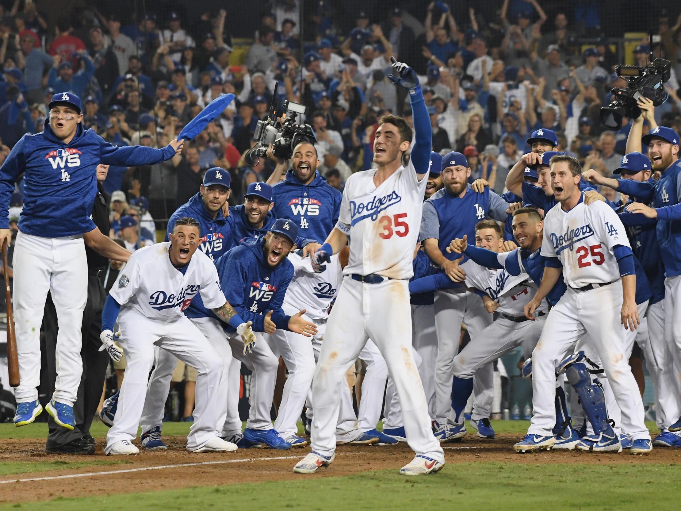 The LA Dodgers celebrate after finally securing victory