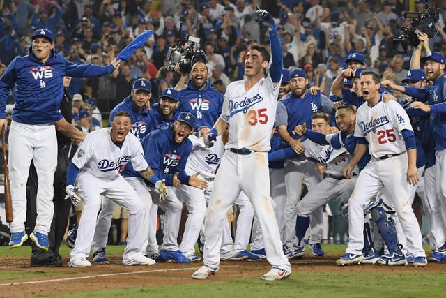 The LA Dodgers celebrate after finally securing victory