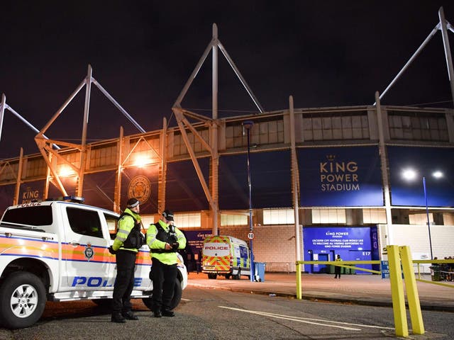 Police officers secure the area outside Leicester City Football Club's King Power Stadium