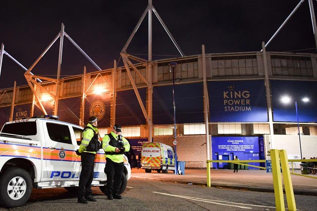 Police officers secure the area outside Leicester City Football Club's King Power Stadium