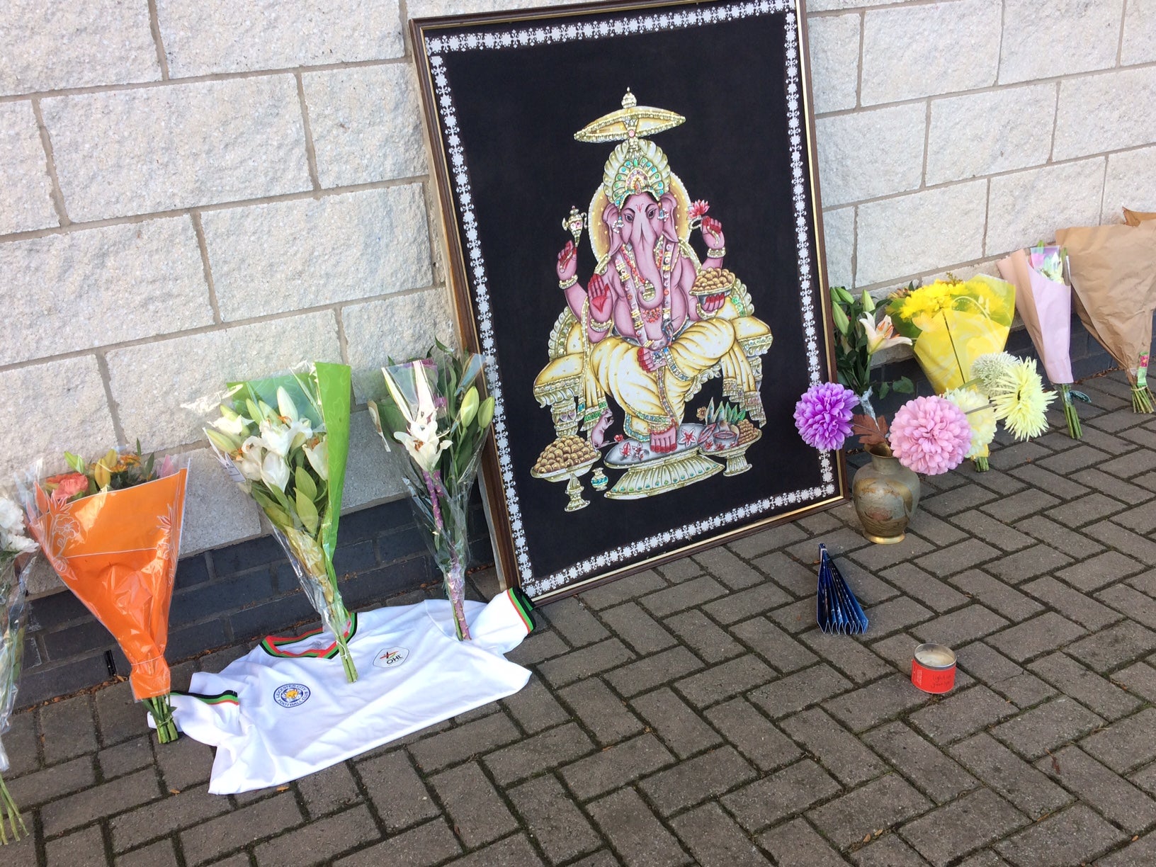 Flowers left at the King Power alongside an image of the Hindu god Ganesh (Sean O'Grady)