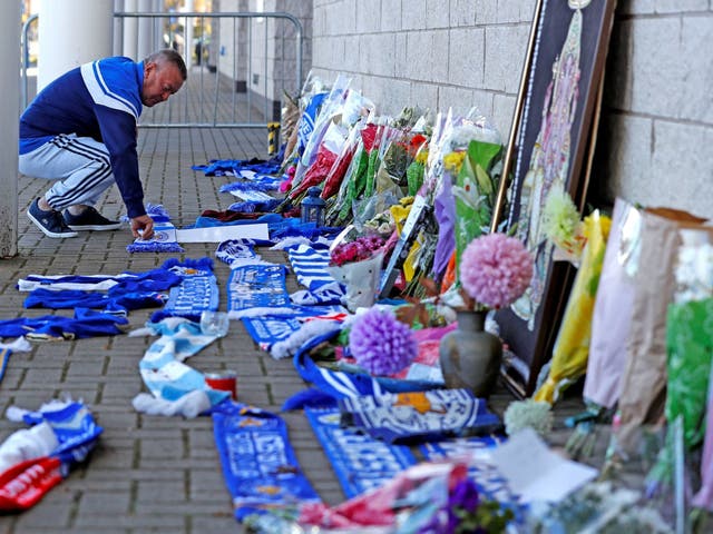 Flowers and scarves were left by fans outside the King Power football stadium following the helicopter crash