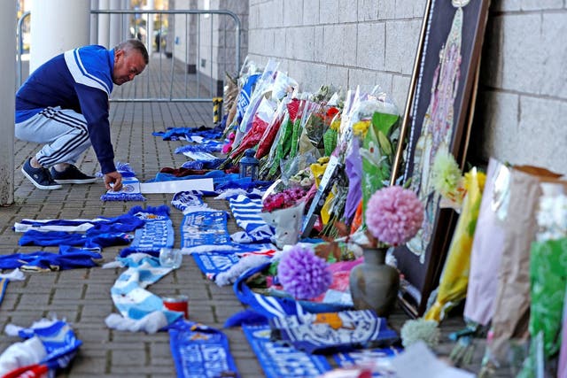 Flowers and scarves were left by fans outside the King Power football stadium following the helicopter crash