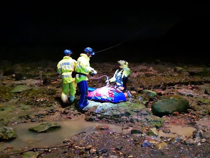 Rescuers prepare to airlift the injured fossil collector to safety