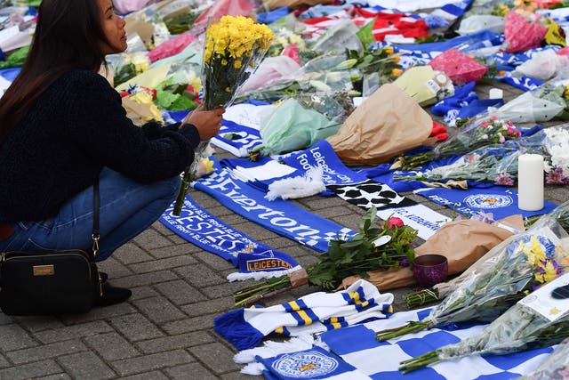 Flowers and scarves from clubs at home and abroad were laid in tribute 