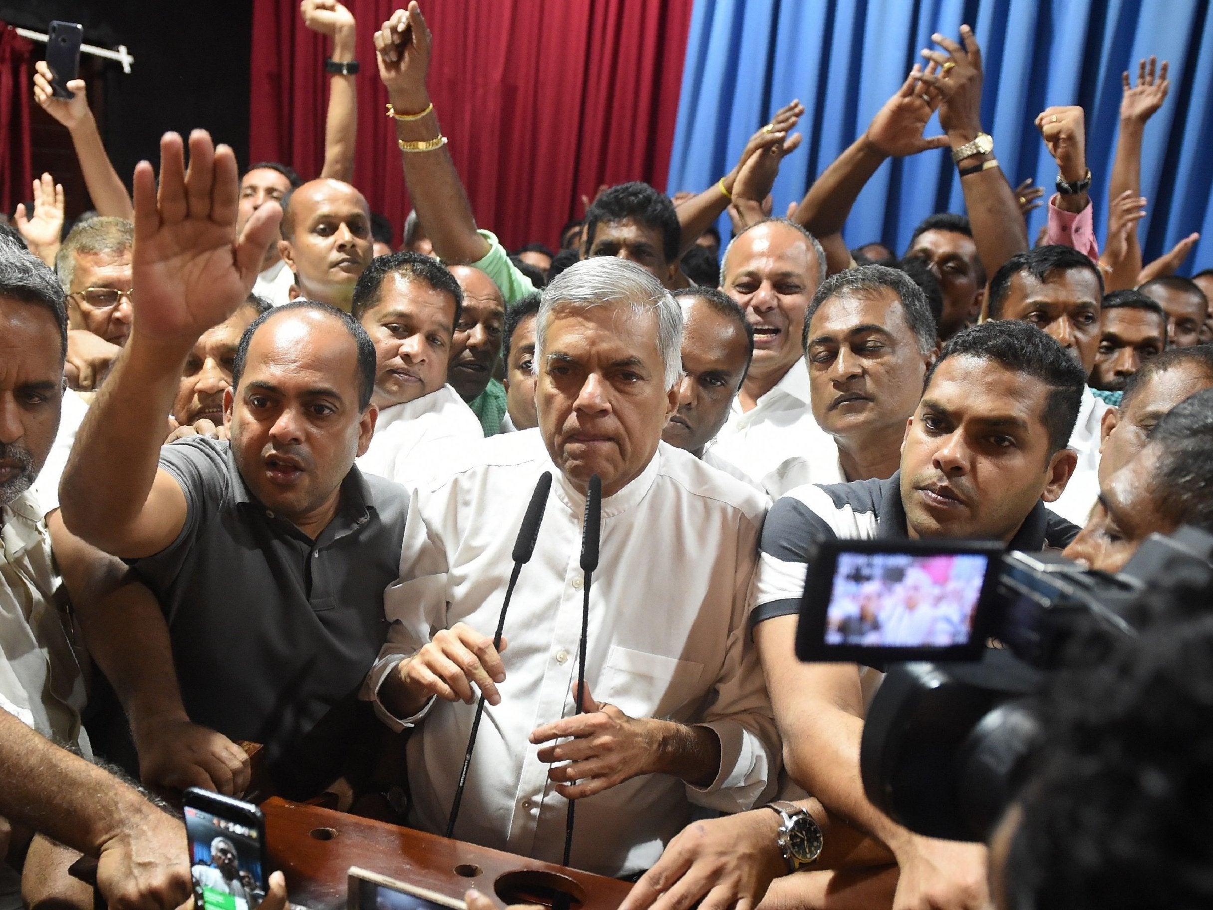 Ousted prime minister Ranil Wickremesinghe with supporters on Saturday