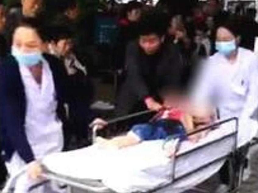 Medics help the 14 children hurt in a mass knife attack in Chongqing, China