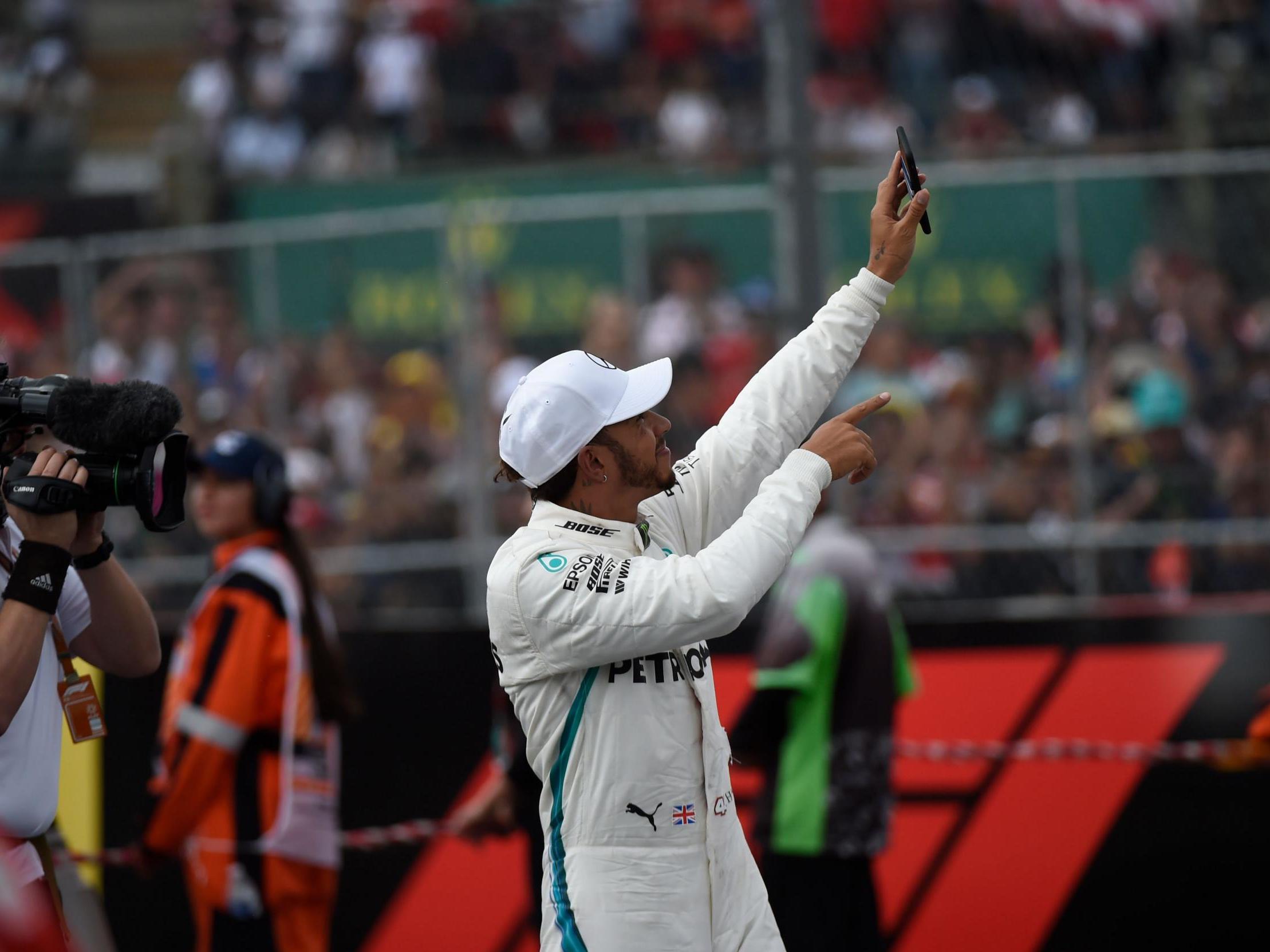 Hamilton acknowledges the crowds after securing his fifth title