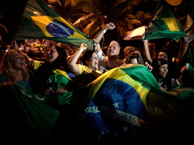 Supporters of Jair Bolsonaro celebrate in front of his residence in Rio de Janeiro, Brazil.