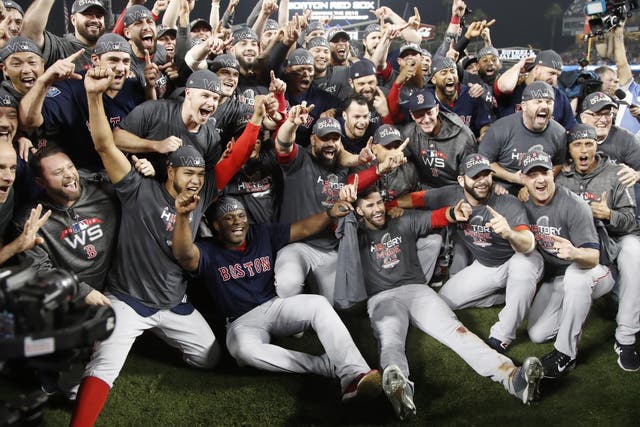 Boston Red Sox players celebrate after winning the World Series
