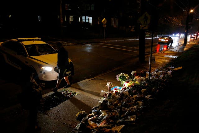 Mourners visit a makeshift memorial outside the Tree of Life synagogue