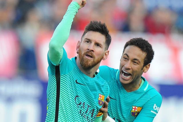 Lionel Messi of FC Barcelona celebrates with Neymar