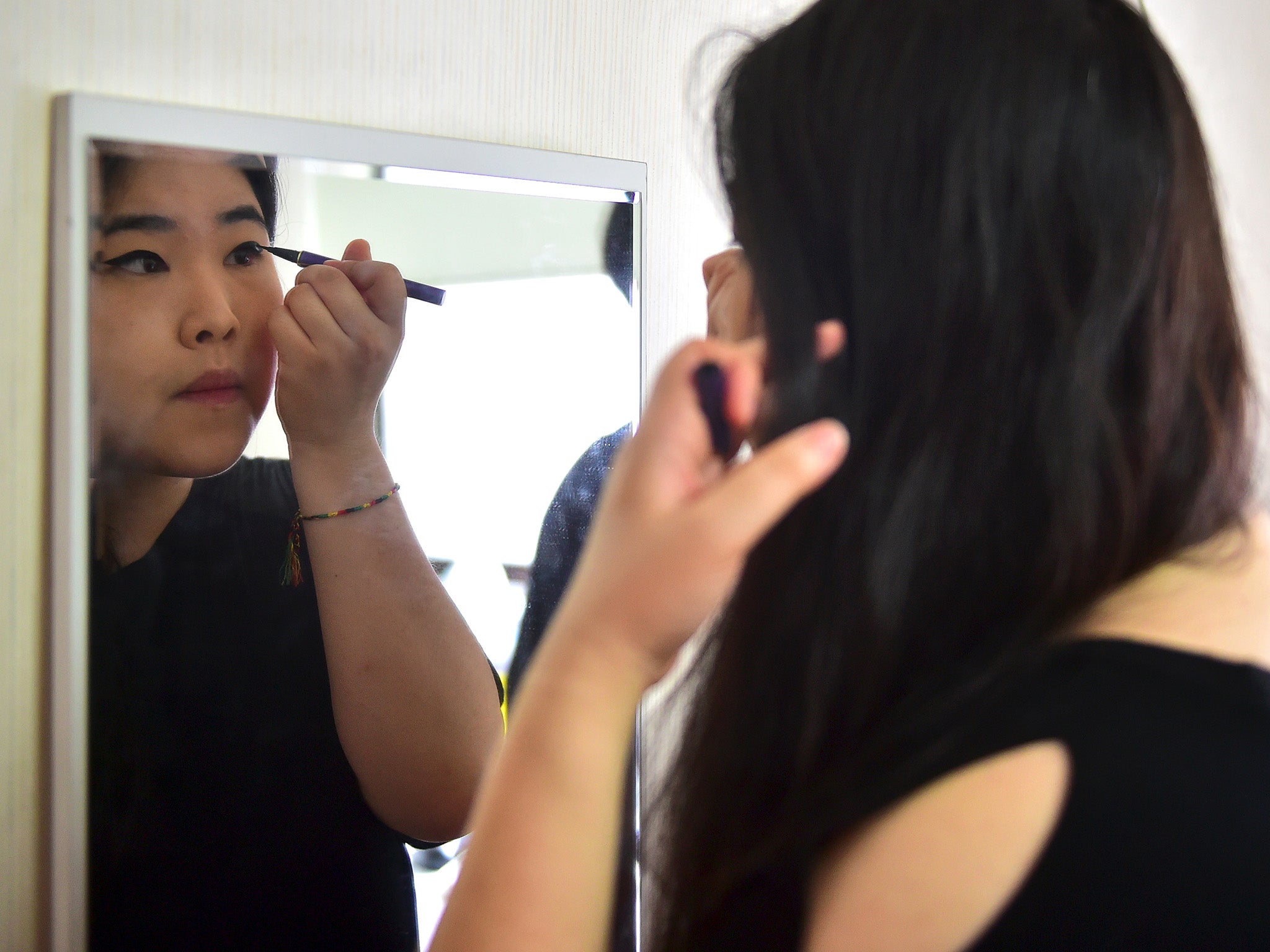 South Korean Women Destroying Makeup In Protest Against Stringent