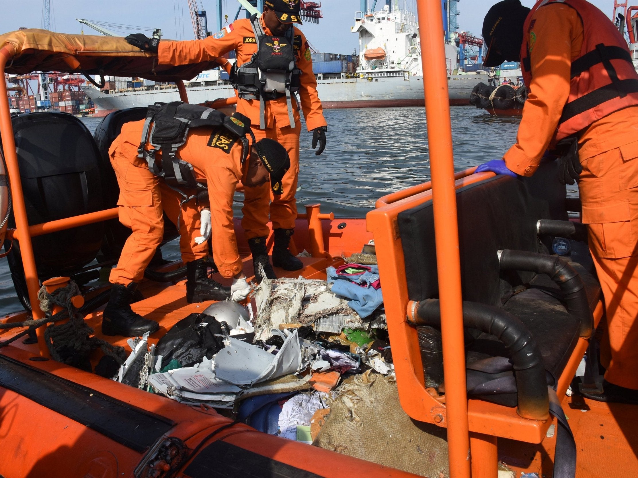 An Indonesian rescue team collect debris after the Lion Air crash