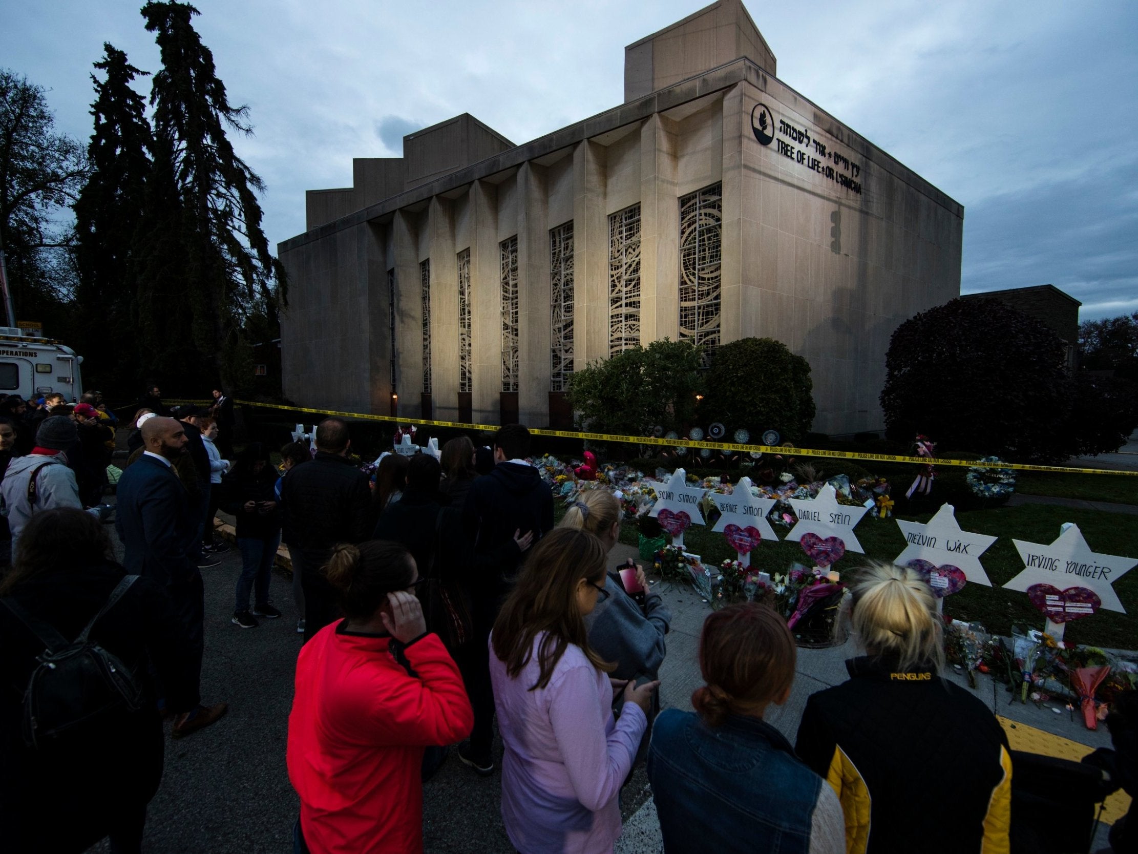 People pay their respects at a makeshift memorial in the aftermath of a deadly shooting at the Tree of Life Synagogue in Pittsburgh