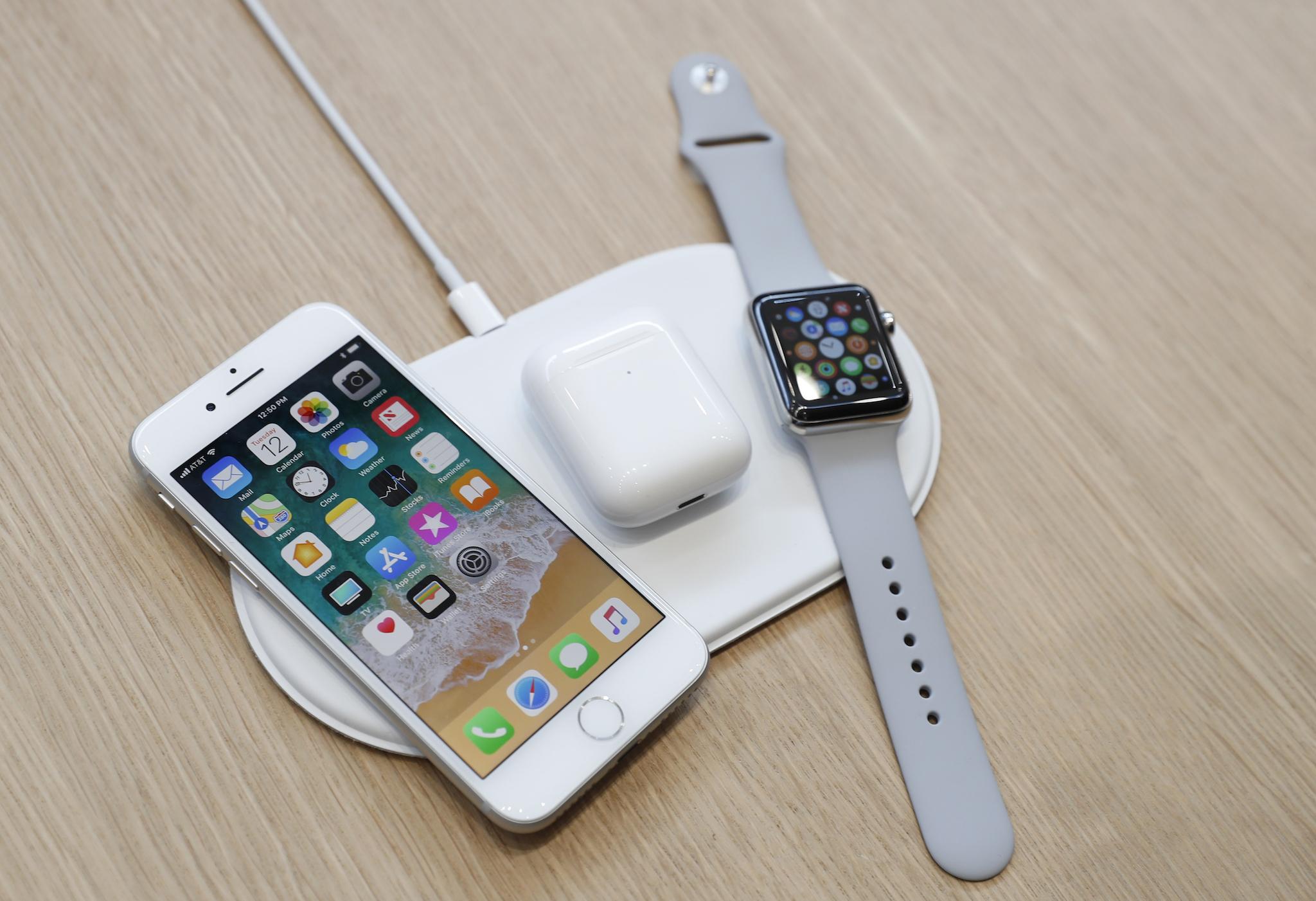 An AirPower wireless charger is displayed along with other products during an Apple launch event in Cupertino, California