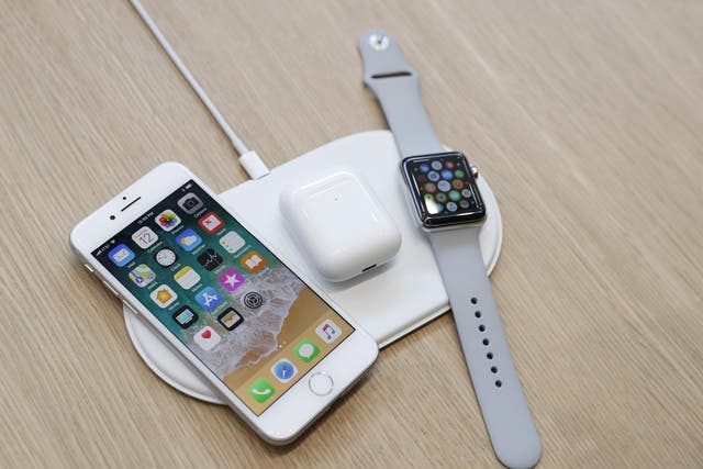 An AirPower wireless charger is displayed along with other products during an Apple launch event in Cupertino, California