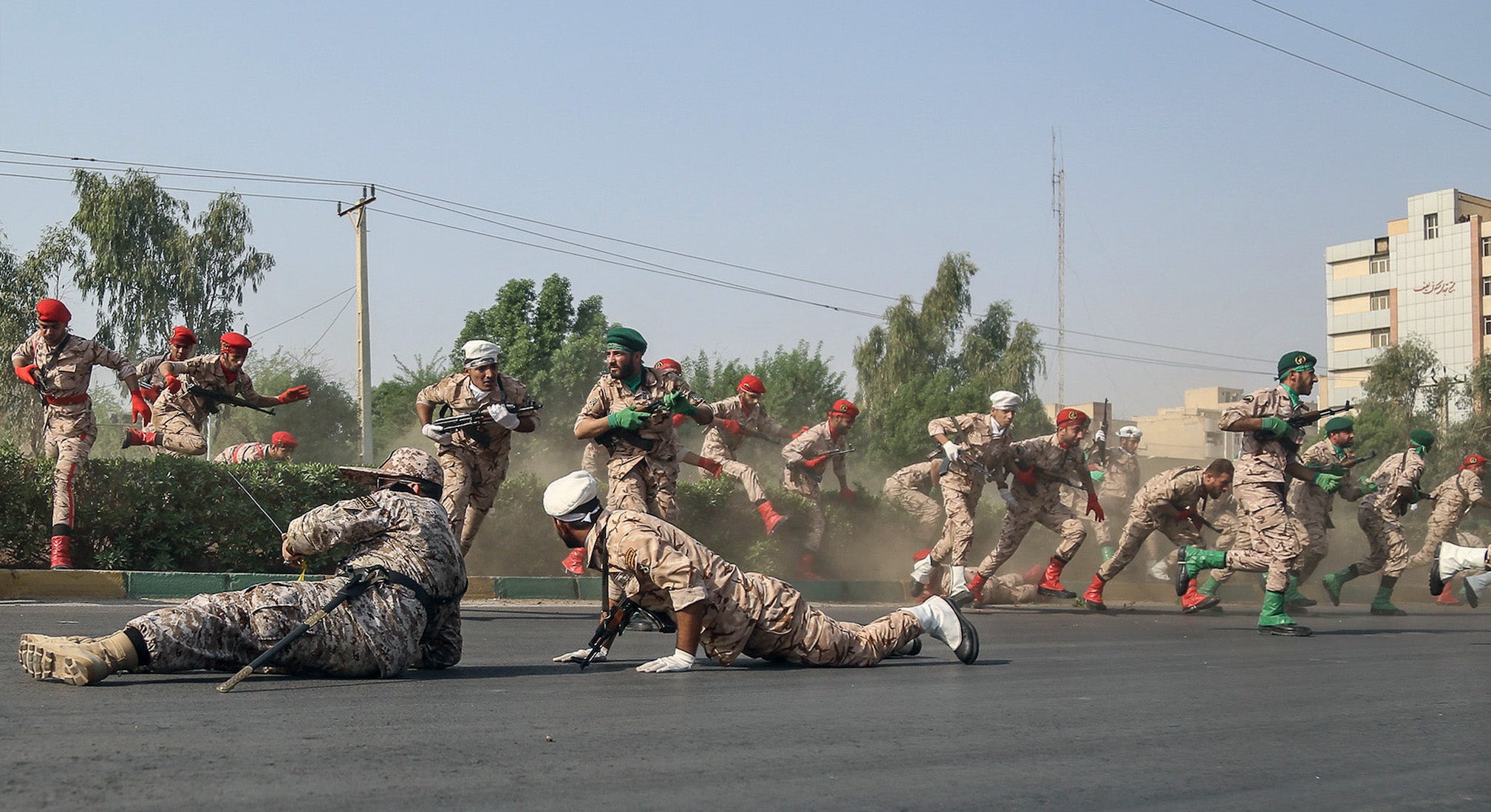 Iranian soldiers run for cover during a terror attack in Ahvaz on 22 September