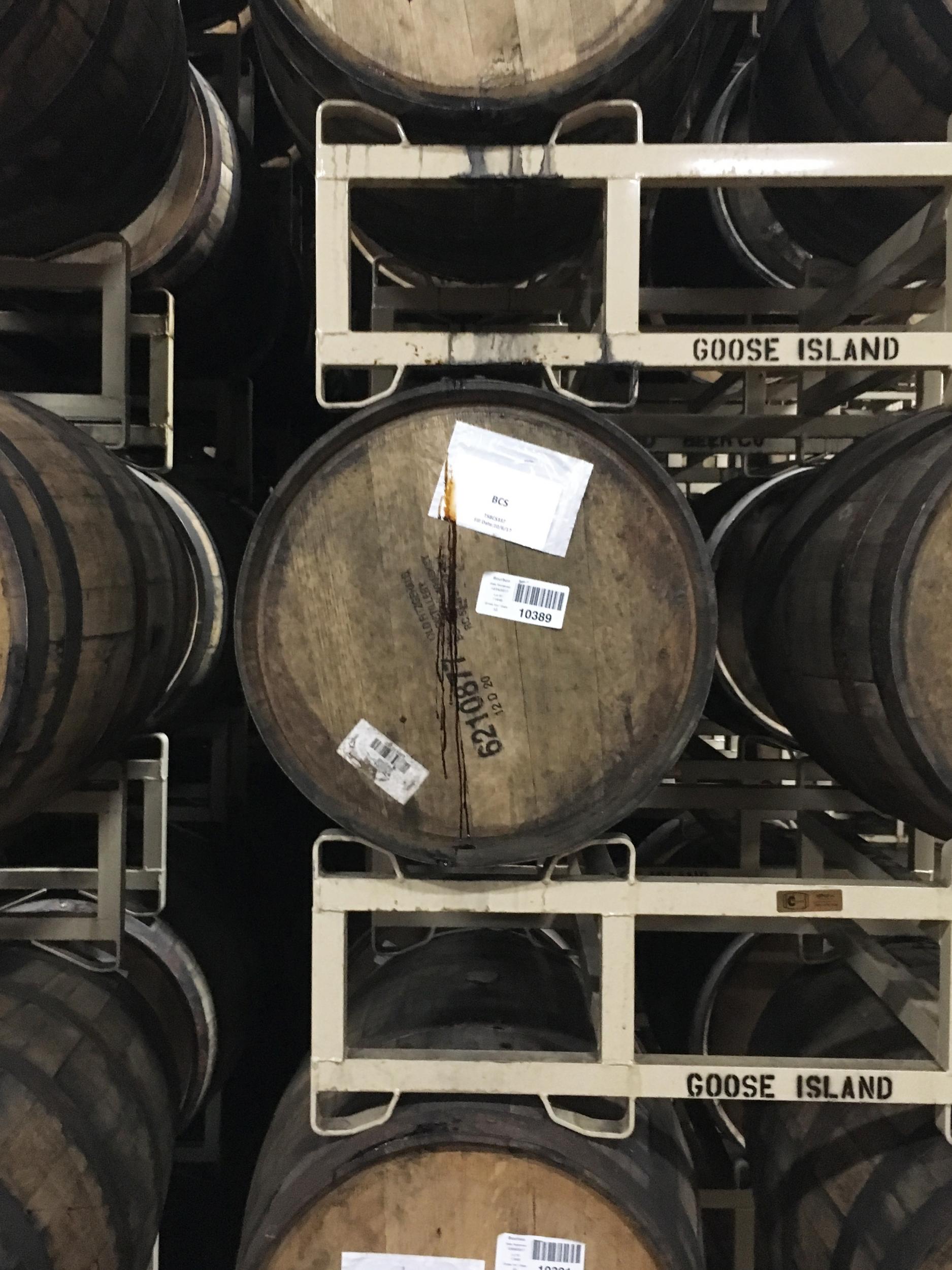 A trickle of the thick, sweet stout escapes from a barrel