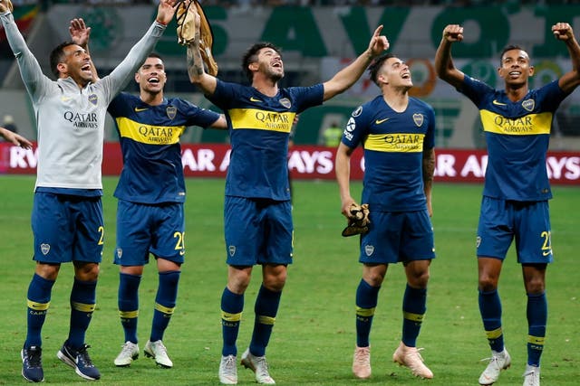 Players of Argentina's Boca Juniors celebrate their 2-2 draw against Brazil's Palmeiras
