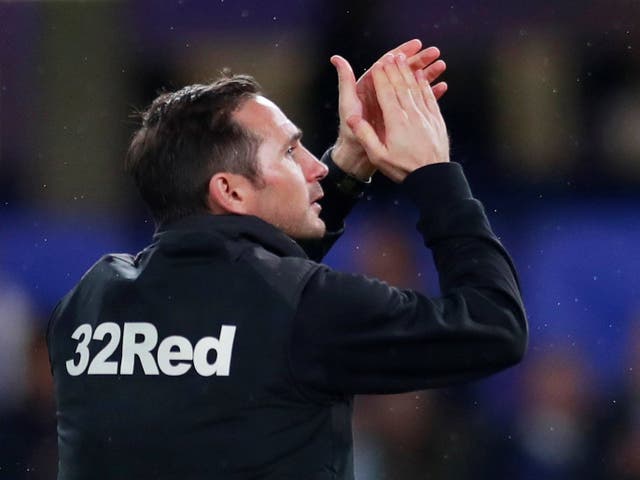 Derby County manager Frank Lampard applauds their fans after the match