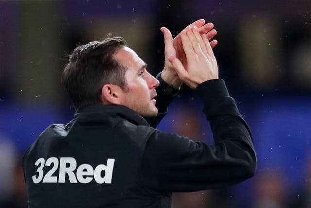 Derby County manager Frank Lampard applauds their fans after the match