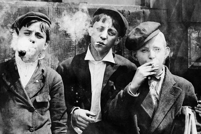Newspaper boys smoking at Skeeter’s Branch near Franklin in St Louis, Missouri, 1910