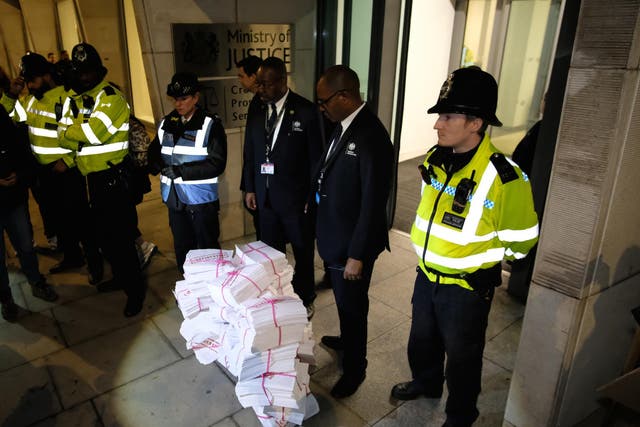 Protesters dumped documents representing rape victims’ phone data outside the CPS’s offices in November
