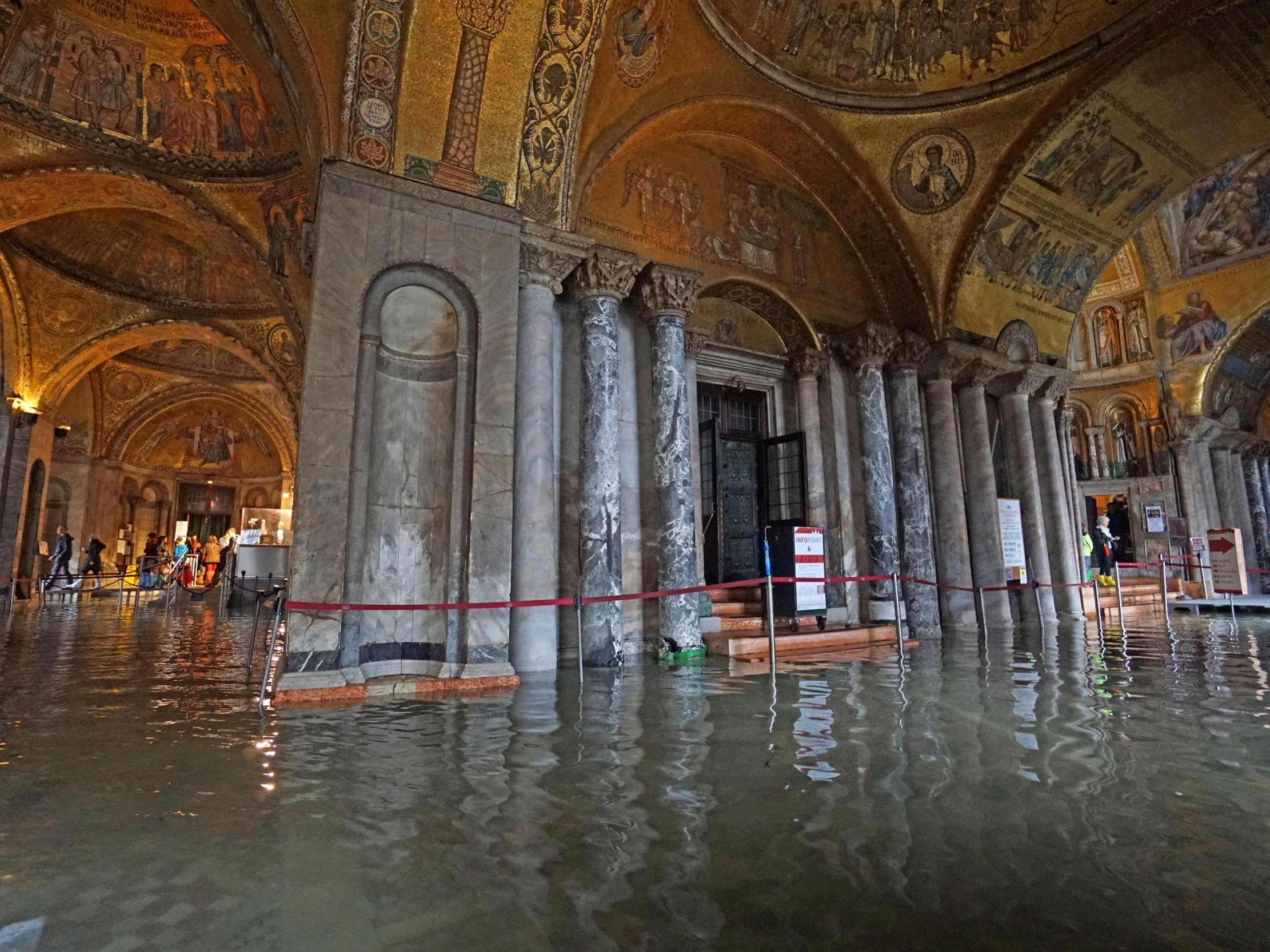 An inside view of the Basilica flooded by the water of the lagoon during high water in Venice