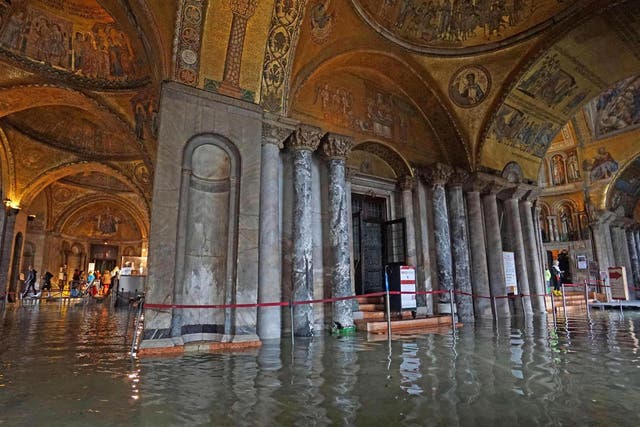 An inside view of the Basilica flooded by the water of the lagoon during high water in Venice
