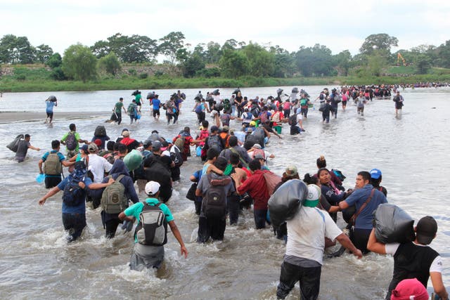 Salvadoran migrants cross the Suchiate river, the border between Guatemala and Mexico