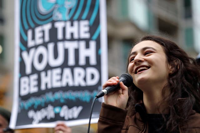 High school junior Jamie Margolin speaks during a rally by youth activists and others in support of the climate change lawsuit in Seattle