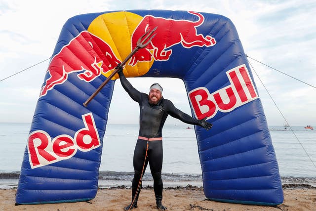 Ross Edgley celebrates finishing his epic journey on Margate beach