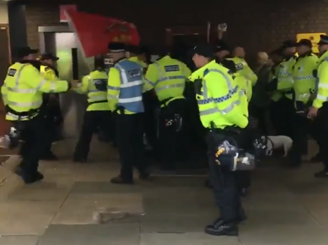 Small group of far-right pro-Brexit campaigners surrounded by police