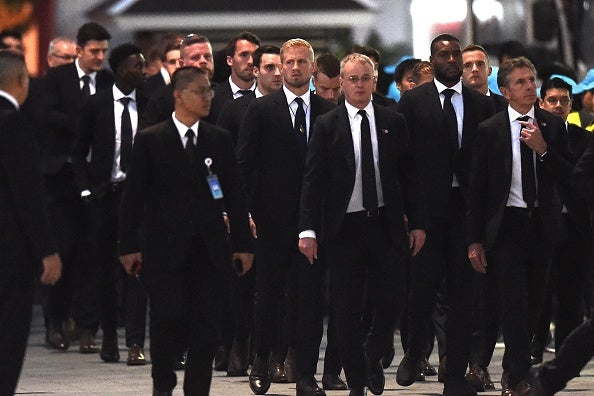 The Leicester squad arrive at the funeral ceremony in Bangkok
