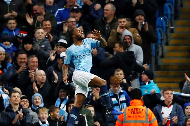 Raheem Sterling punches the air after scoring his second goal for Manchester City