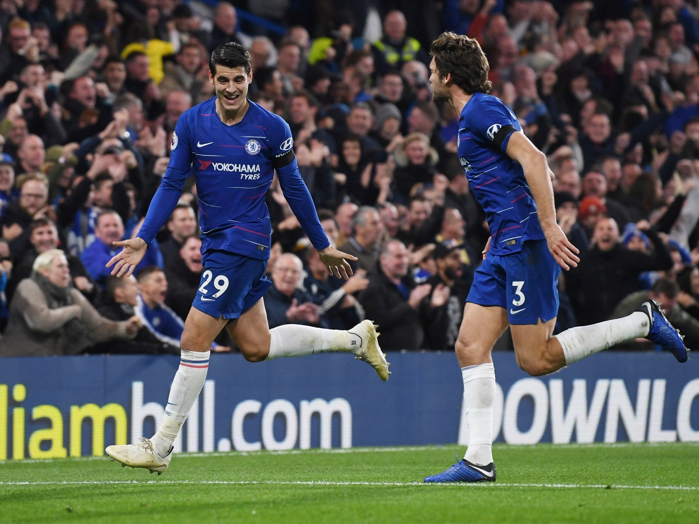 Morata celebrates with Marcos Alonso after scoring his second