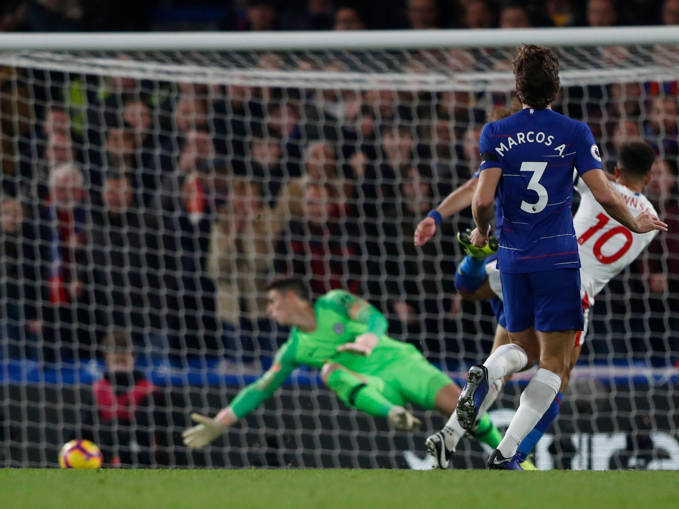 Andros Townsend places the ball past Kepa to draw Palace level